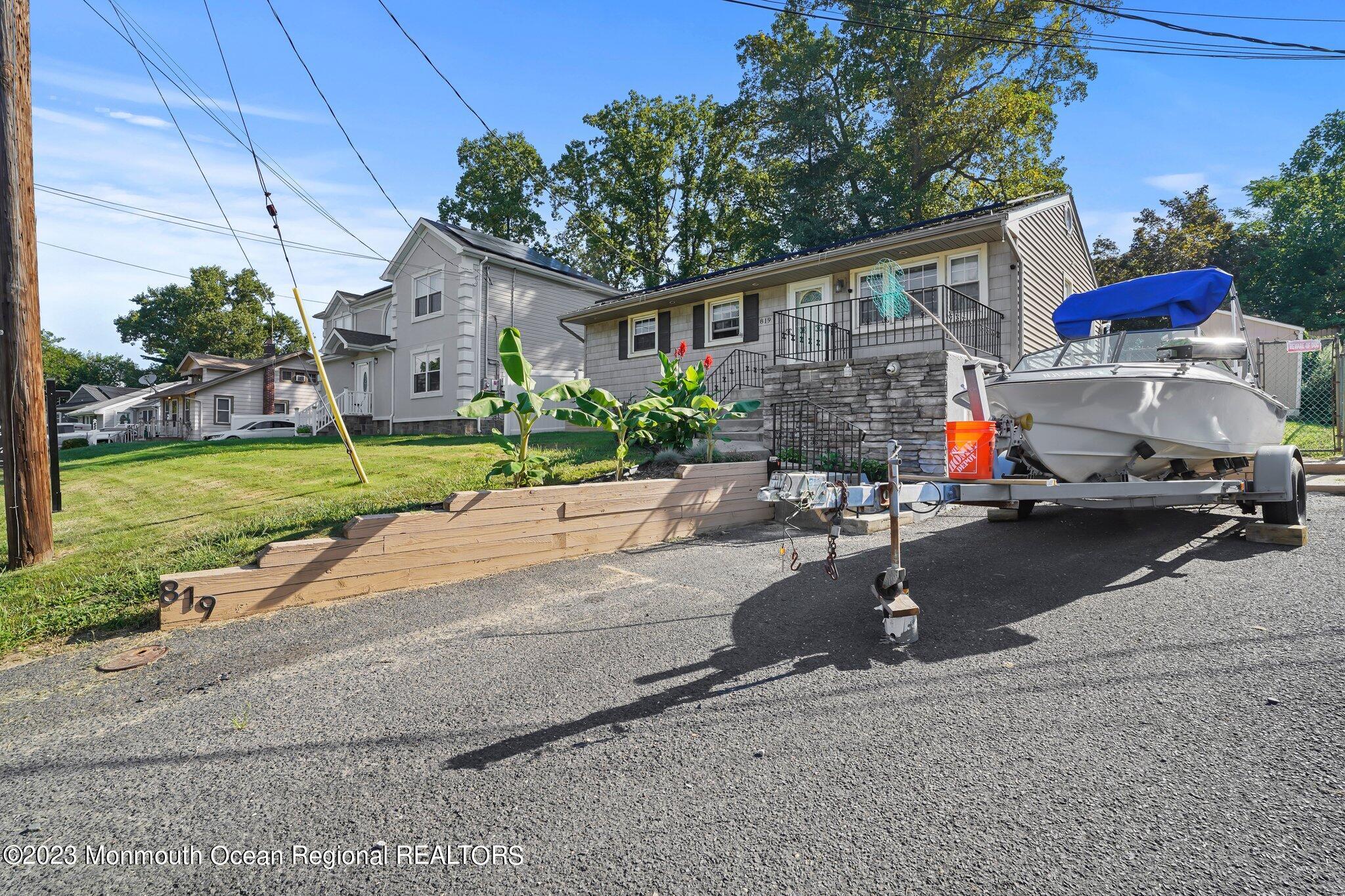 819 Shore Concourse Keyport, NJ 07735 - Photo 4 of 26 a view of a house with backyard sitting area and garden