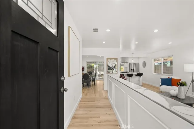 a large white kitchen with lots of counter space