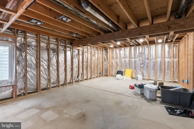 a view of an empty room with wooden walls