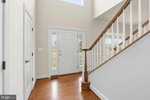 a bathroom with a bathtub a sink a toilet and a window