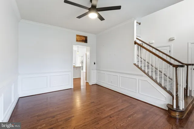 a view of an entryway with wooden floor
