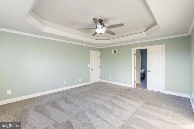 a view of an empty room with gym equipment
