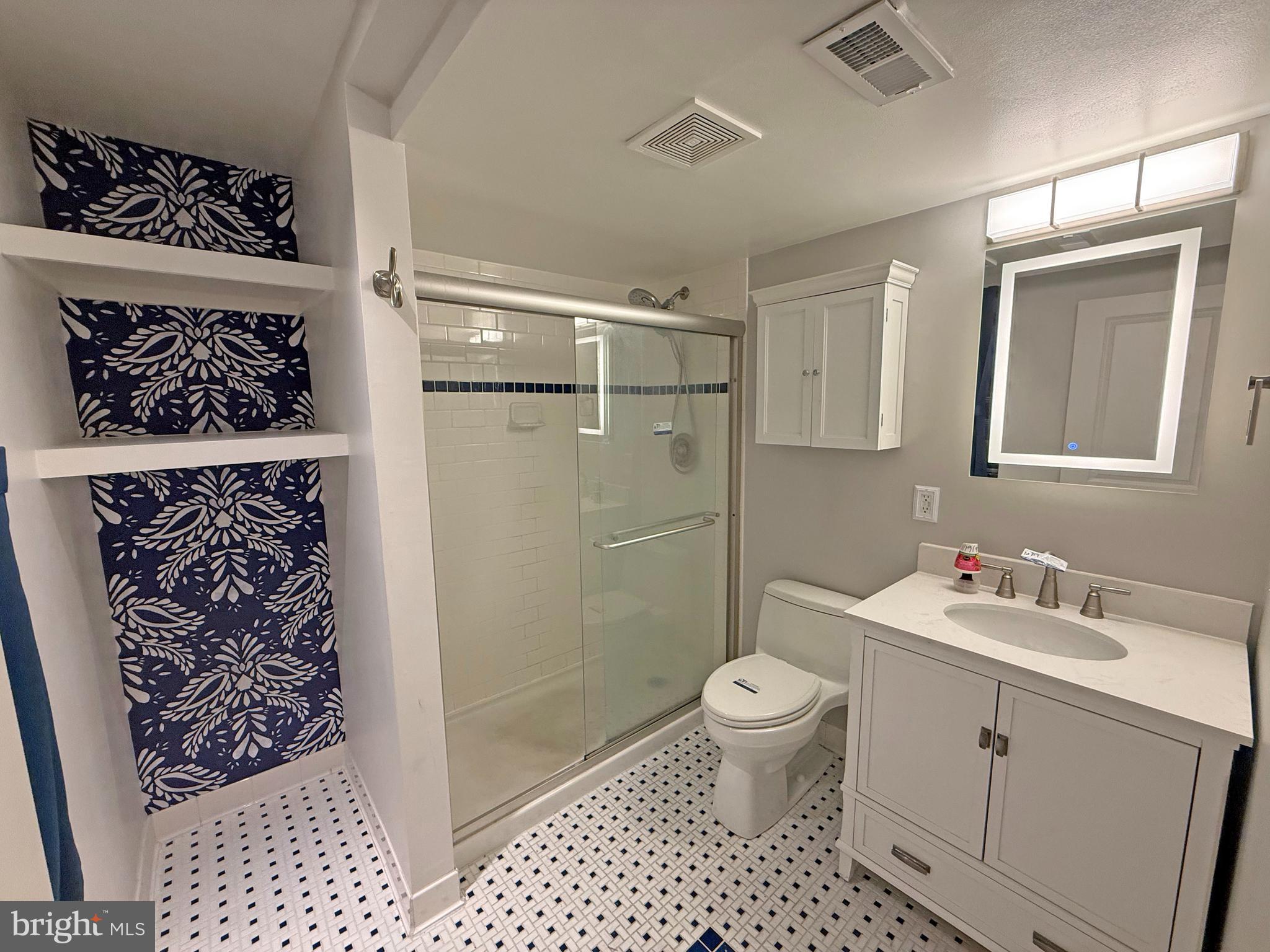 402 Grindall Street, Unit A Baltimore, MD 21230 - Photo 18 of 18 a bathroom with a sink toilet and shower