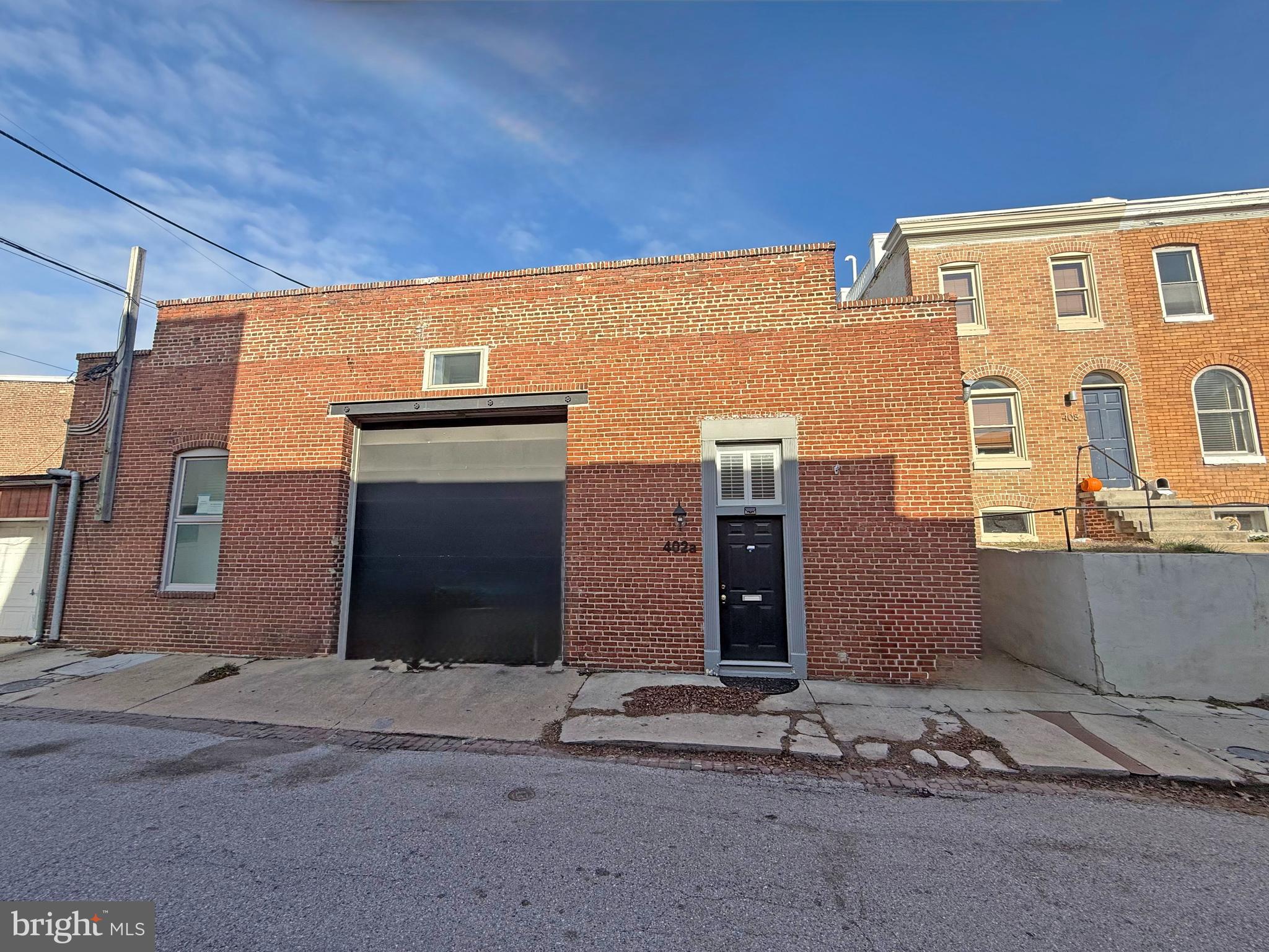 402 Grindall Street, Unit A Baltimore, MD 21230 - Photo 3 of 18 a front view of a house with a yard