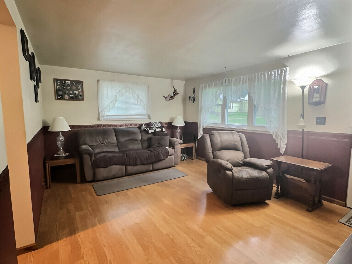 1239 9th Avenue South Clinton, IA 52732 - Photo 2 of 10 a living room with furniture and a couch