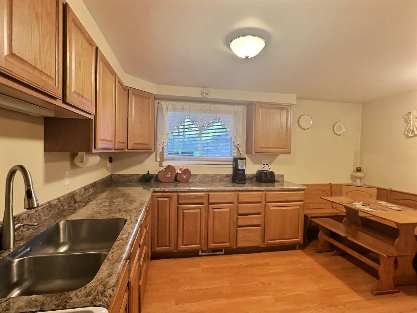 1239 9th Avenue South Clinton, IA 52732 - Photo 3 of 10 a kitchen with a sink and cabinets