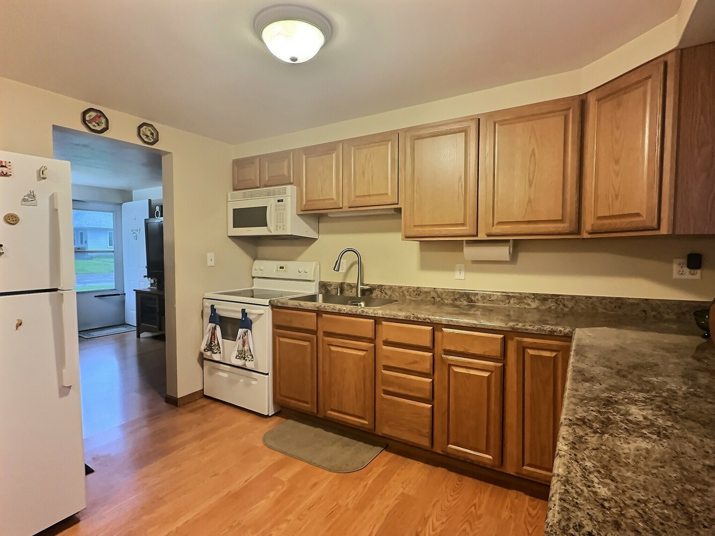 1239 9th Avenue South Clinton, IA 52732 - Photo 4 of 10 a kitchen with granite countertop a sink stainless steel appliances and cabinets