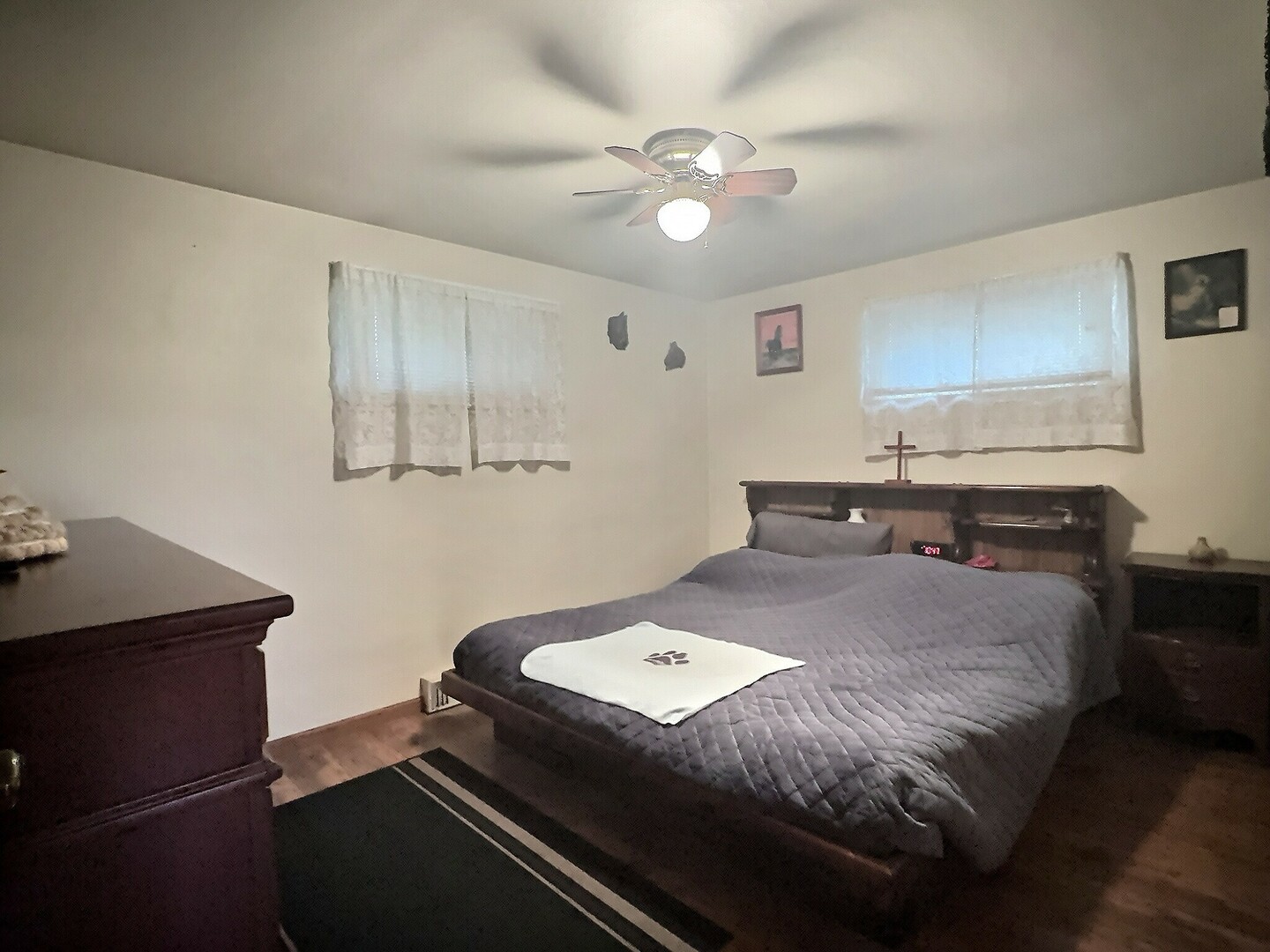 1239 9th Avenue South Clinton, IA 52732 - Photo 5 of 10 a bed room with a bed window and a chandelier