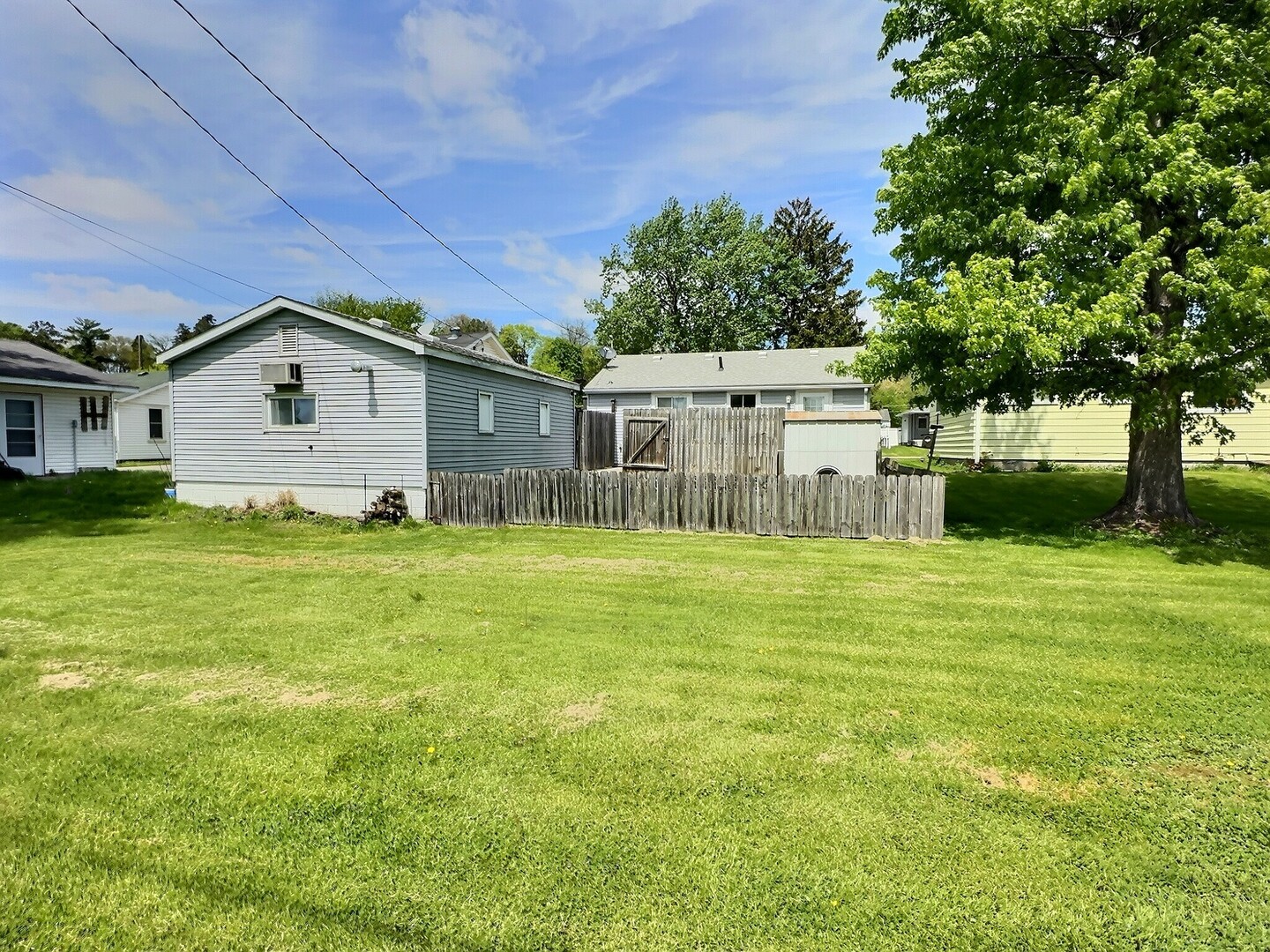 1239 9th Avenue South Clinton, IA 52732 - Photo 10 of 10 a front view of a house with a garden