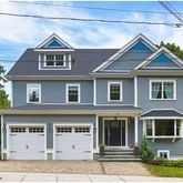 a front view of a house with garage