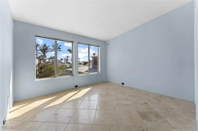 a living room with furniture and large window