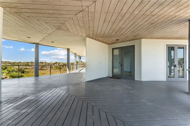 a view of a room with gym equipment and windows