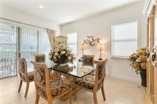 a dining room with furniture and window