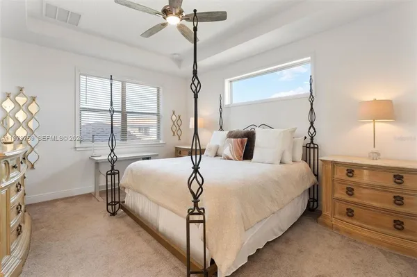 a bedroom with a bed and a table