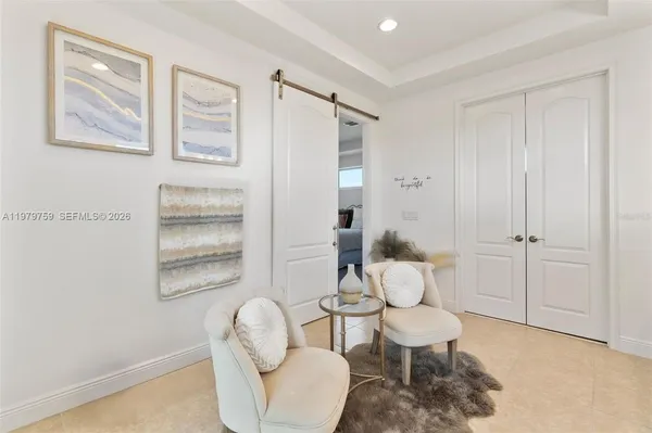 a living room with furniture and a window