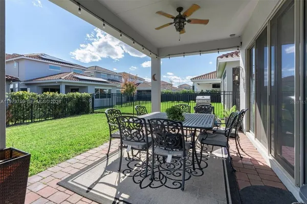 a view of a patio with a table and chairs