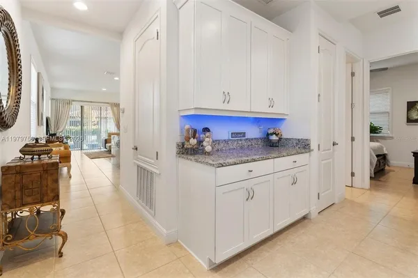 a kitchen with stainless steel appliances granite countertop a sink and cabinets