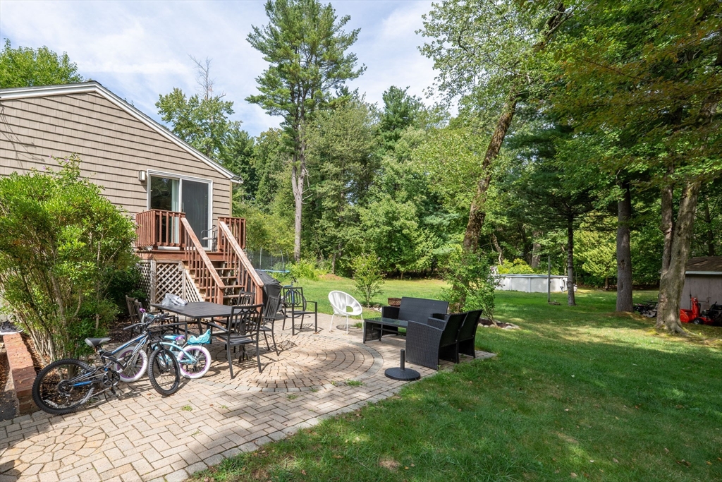 8 Governor Fuller Road Billerica, MA 01821 - Photo 4 of 33 a view of a house with backyard porch and sitting area