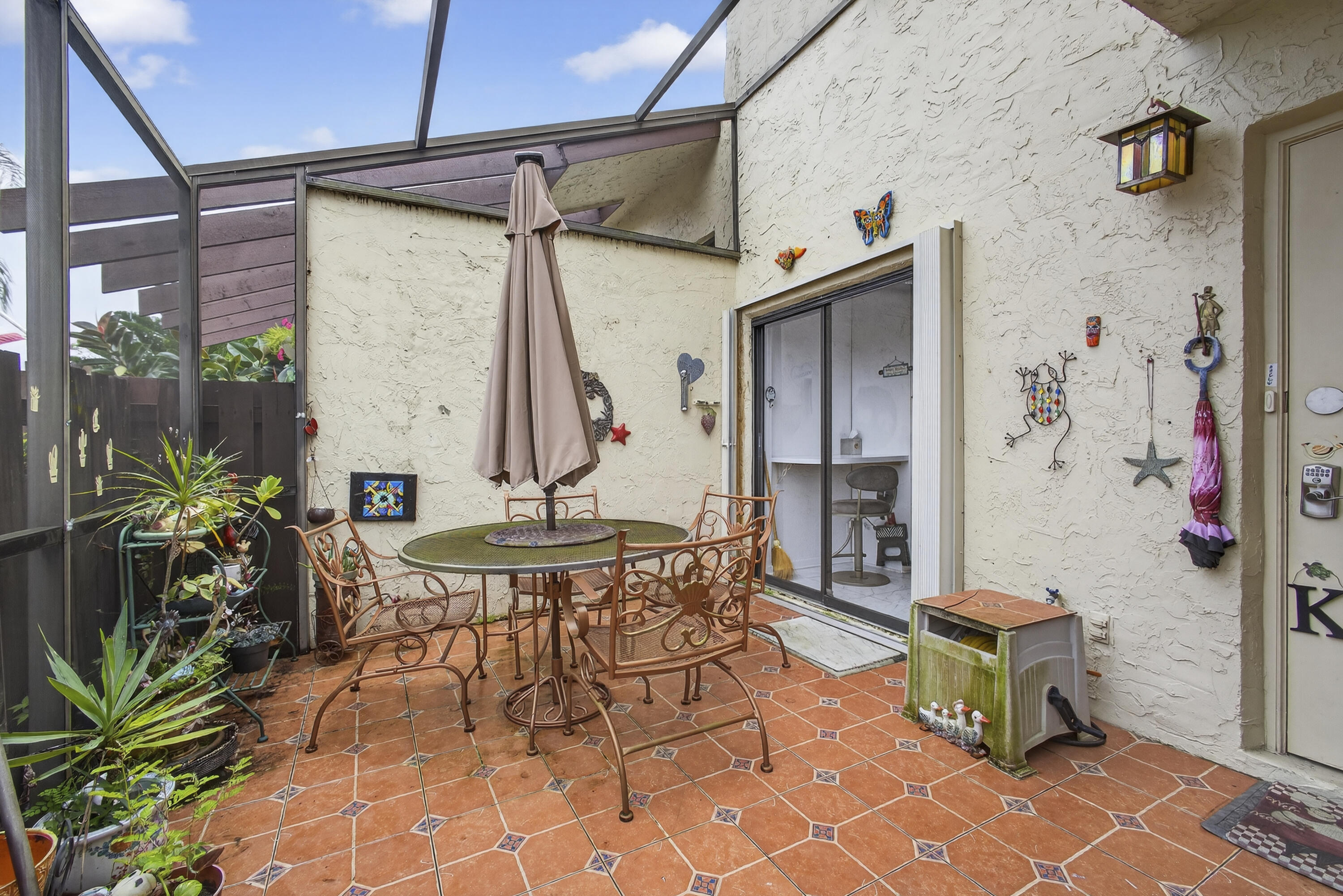 13971 Nesting Way, Unit D Delray Beach, FL 33484 - Photo 1 of 26 Outdoor front patio