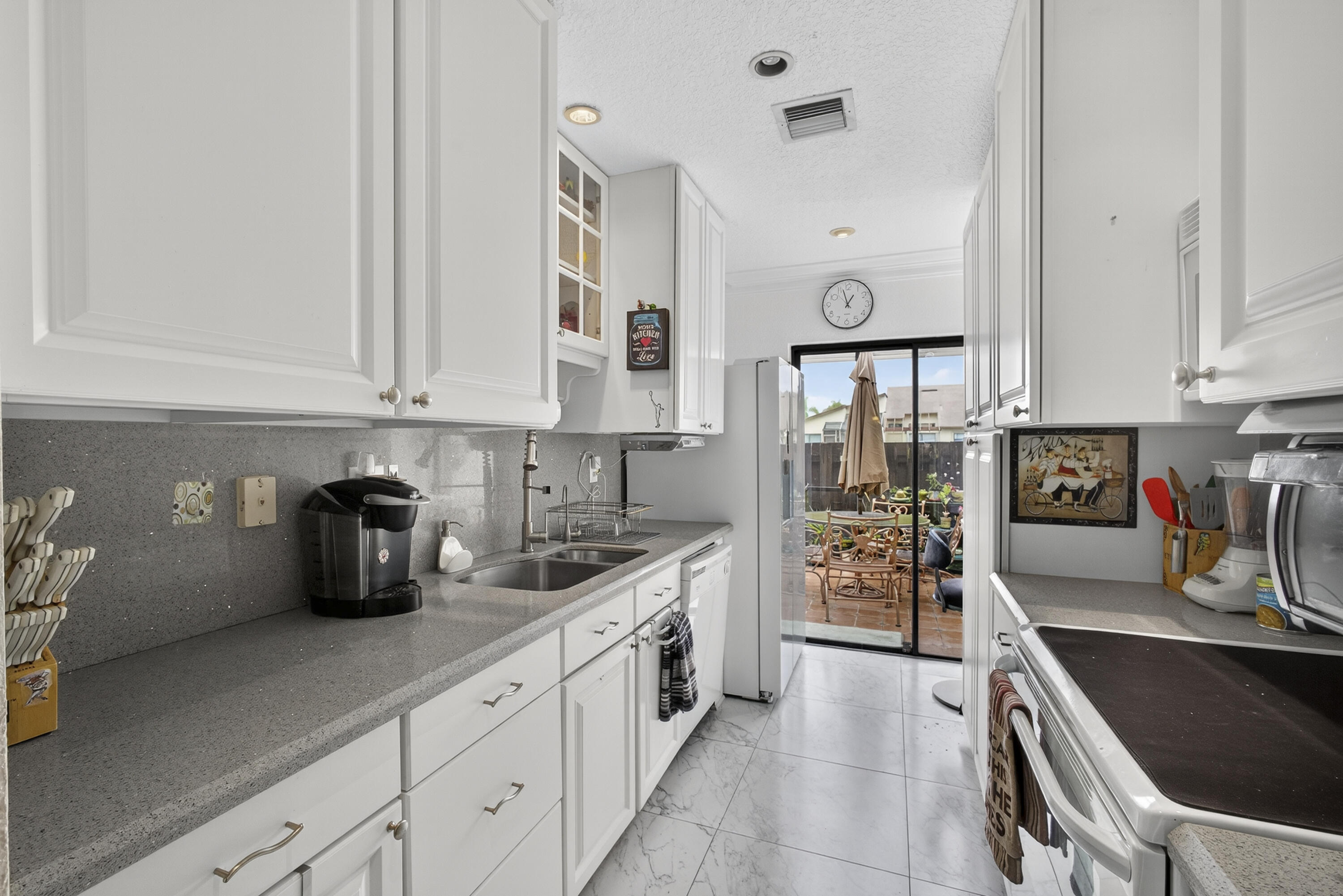 13971 Nesting Way, Unit D Delray Beach, FL 33484 - Photo 12 of 26 Galley Kitchen