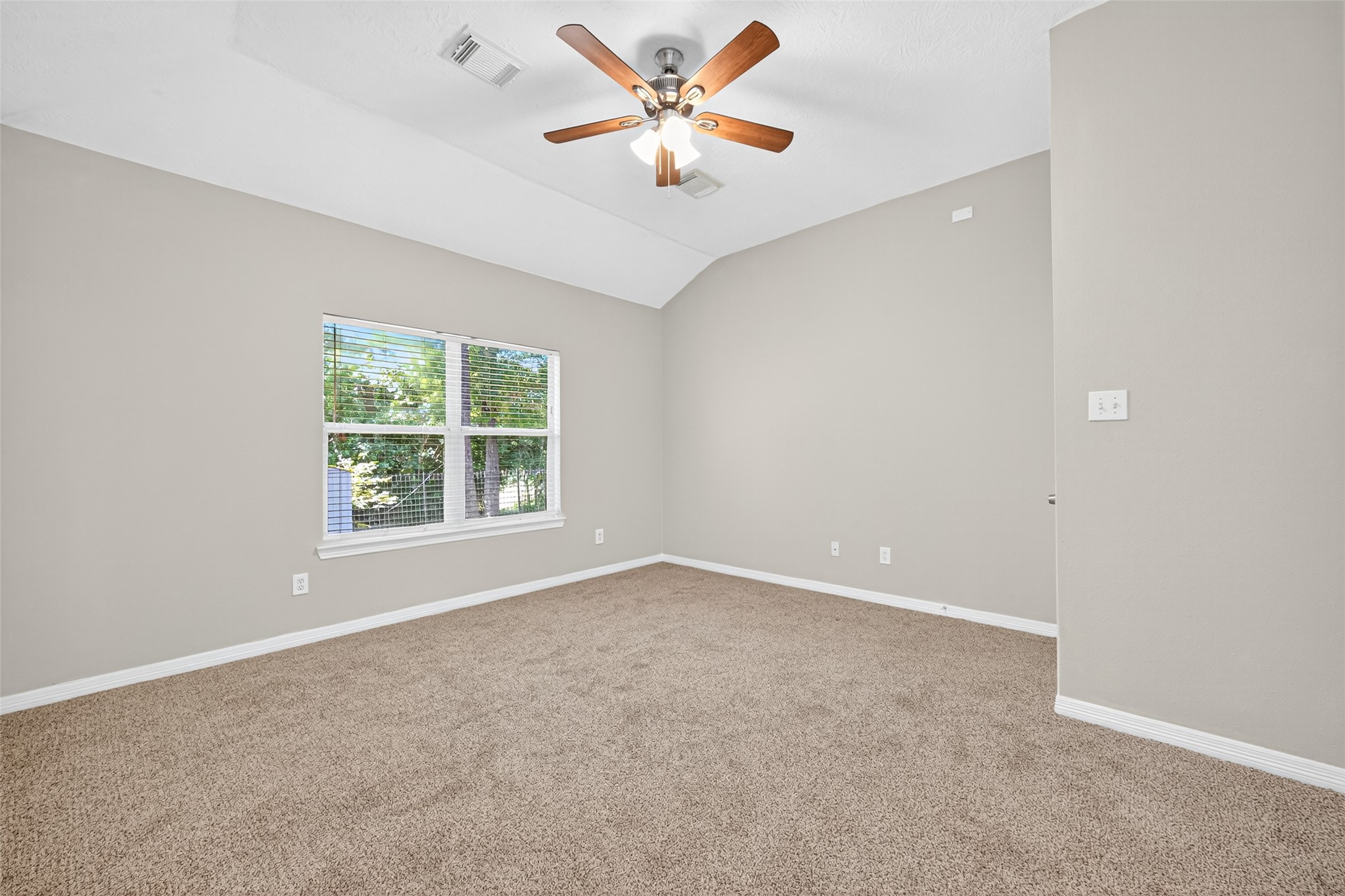 22215 Jay Drive Spring, TX 77373 - Photo 14 of 21 an empty room with a window and a fan