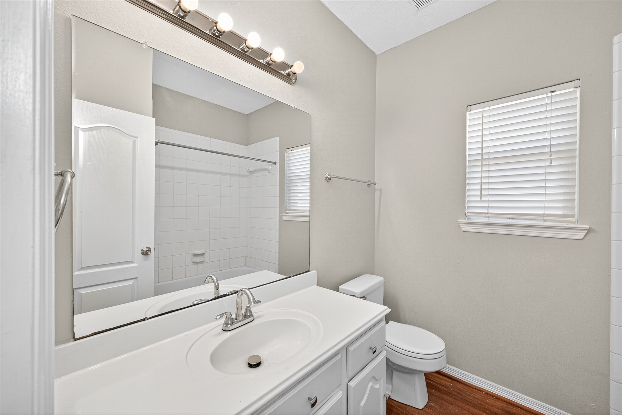 22215 Jay Drive Spring, TX 77373 - Photo 17 of 21 a bathroom with a sink toilet and vanity