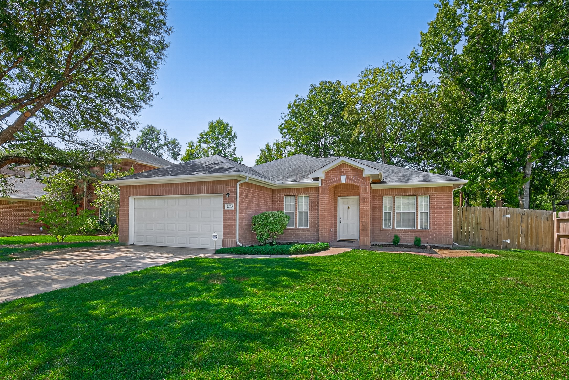 22215 Jay Drive Spring, TX 77373 - Photo 2 of 21 a front view of house with yard and green space