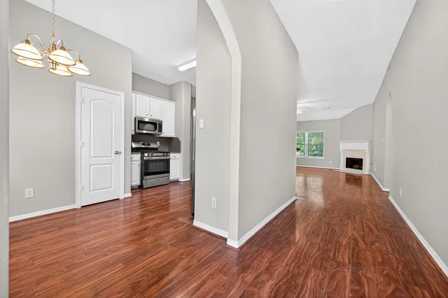 a view of a kitchen with a hard wood floor