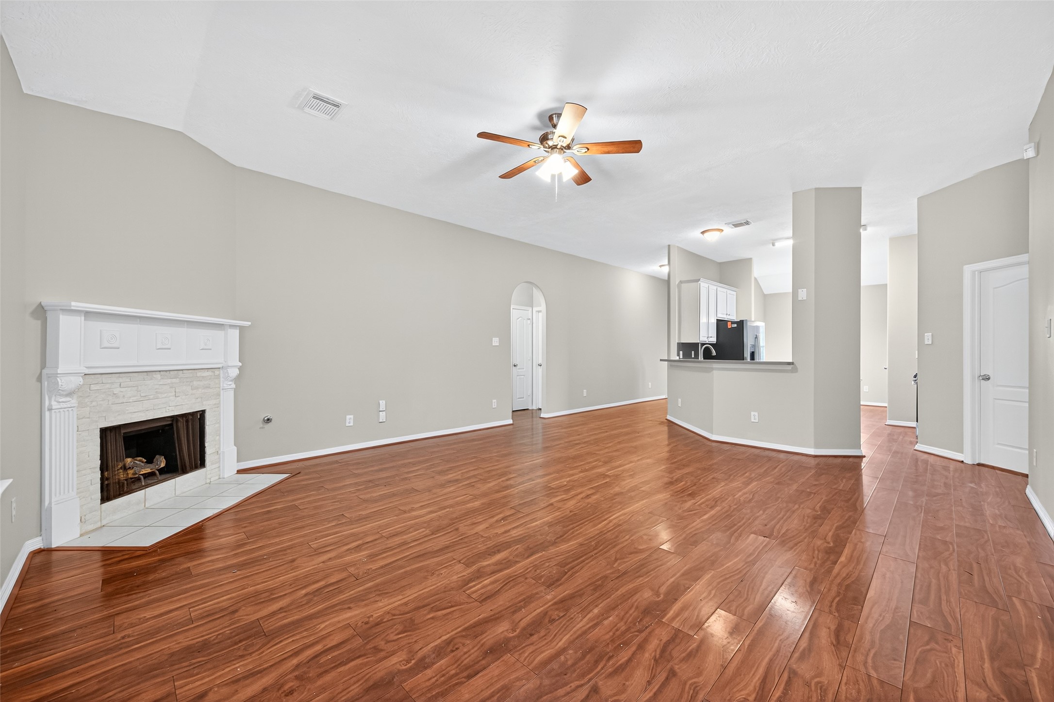 22215 Jay Drive Spring, TX 77373 - Photo 8 of 21 a view of empty room with wooden floor and fireplace