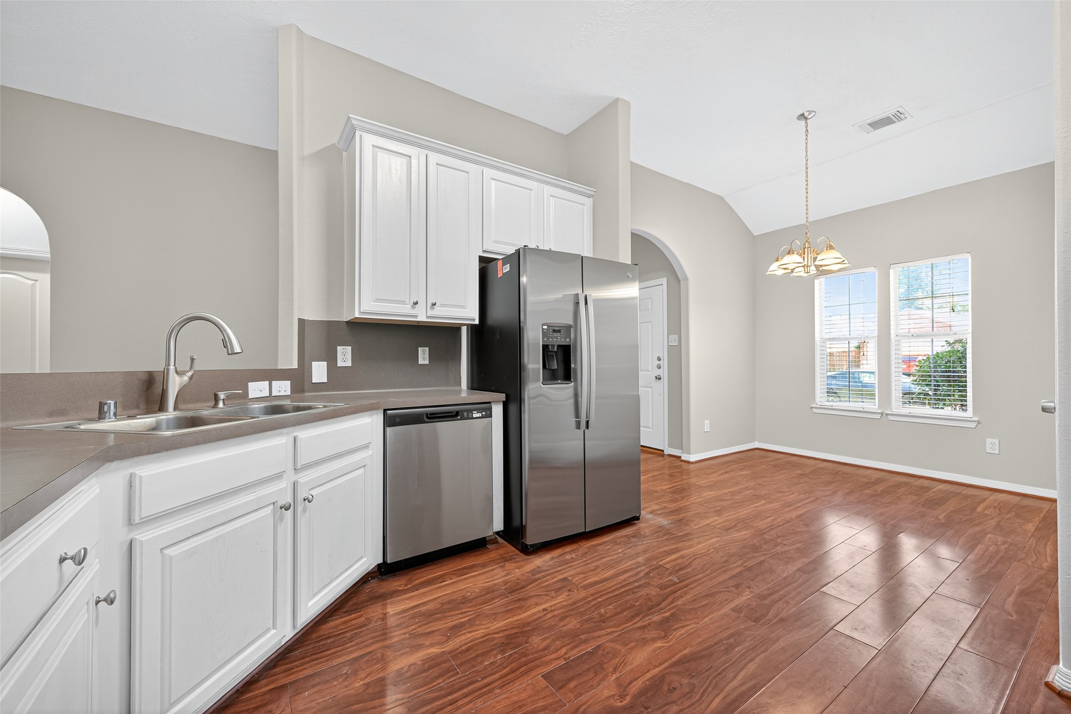 22215 Jay Drive Spring, TX 77373 - Photo 9 of 21 a kitchen with a refrigerator sink and cabinets