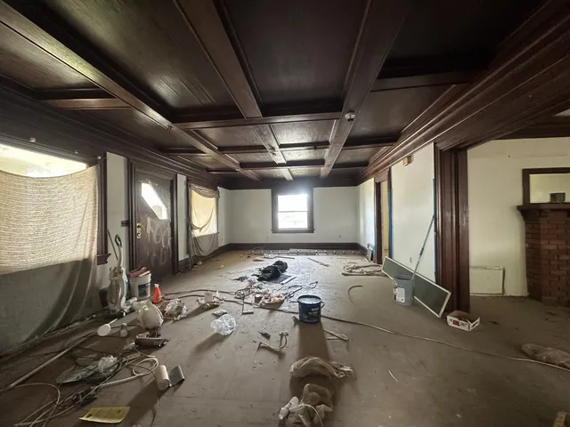 a room with gym equipment and windows