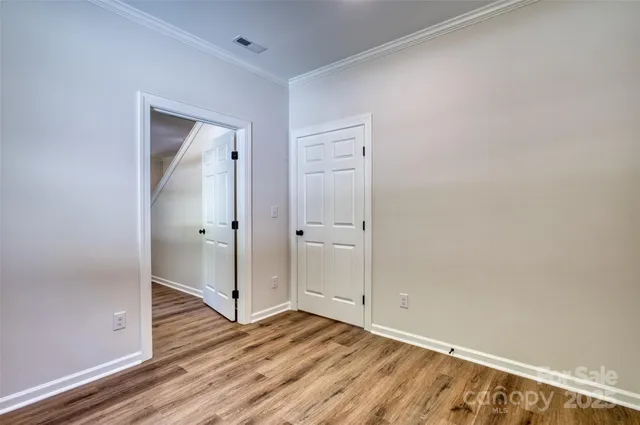 wooden floor and white doors