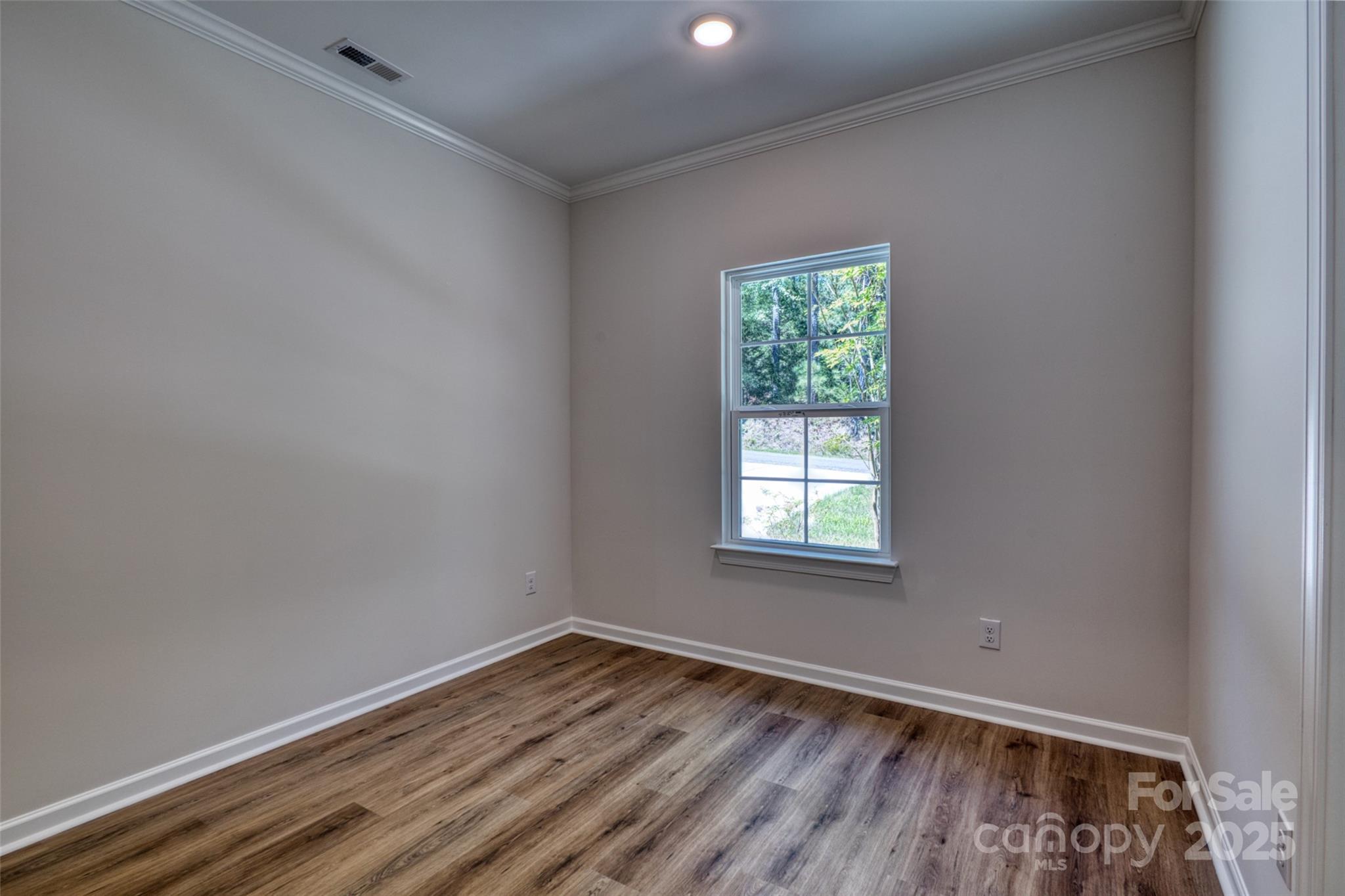 1541 Riverview Circle Fort Lawn, SC 29714 - Photo 12 of 48 an empty room with wooden floor and windows