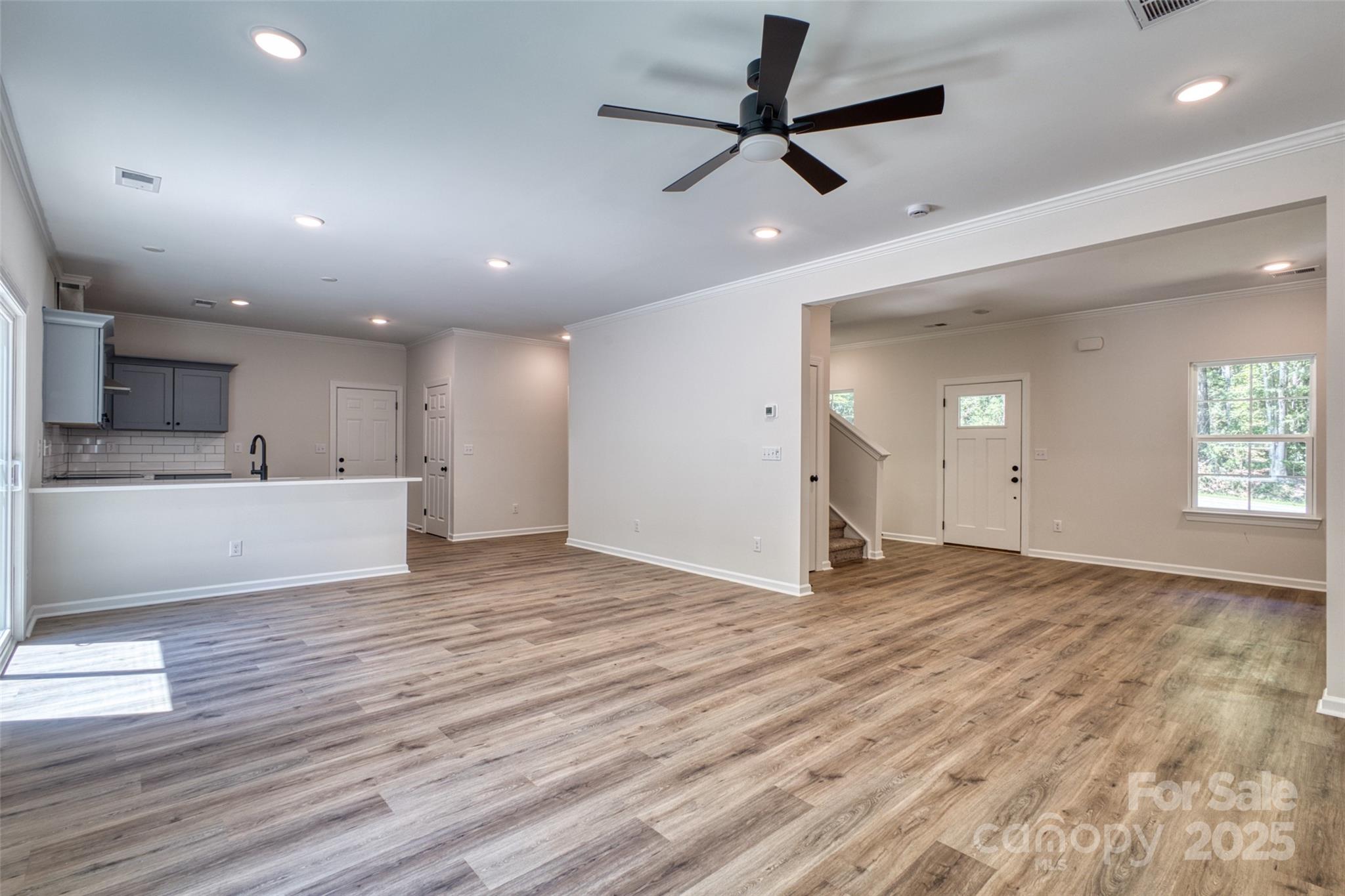 1541 Riverview Circle Fort Lawn, SC 29714 - Photo 19 of 48 a view of an empty room with window and wooden floor
