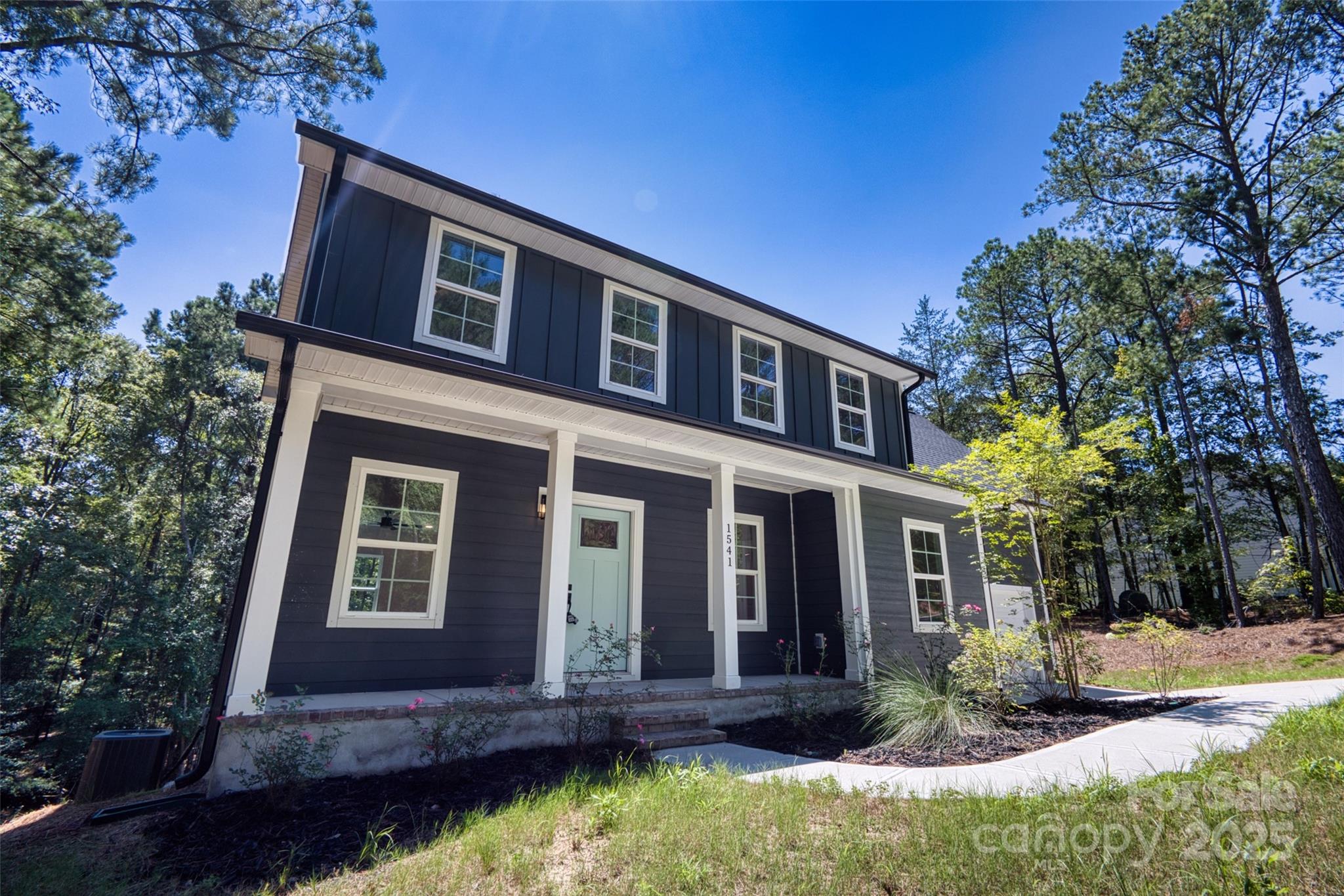 1541 Riverview Circle Fort Lawn, SC 29714 - Photo 3 of 48 a front view of a house with a yard