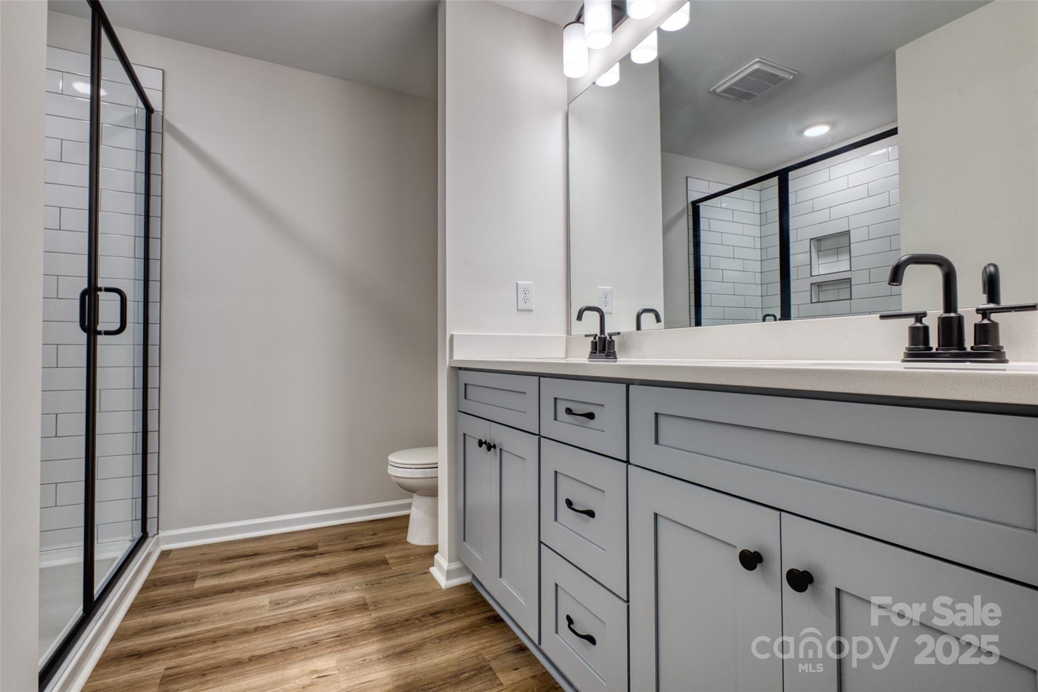 1541 Riverview Circle Fort Lawn, SC 29714 - Photo 32 of 48 a bathroom with a double vanity sink and mirror