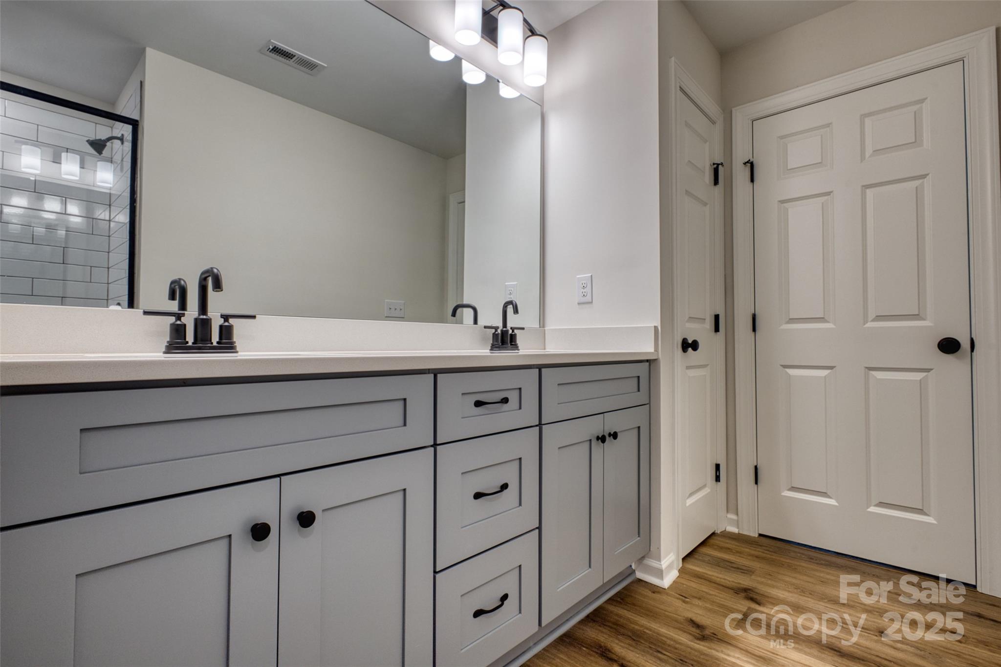 1541 Riverview Circle Fort Lawn, SC 29714 - Photo 34 of 48 a bathroom with a double vanity sink a mirror and a shower