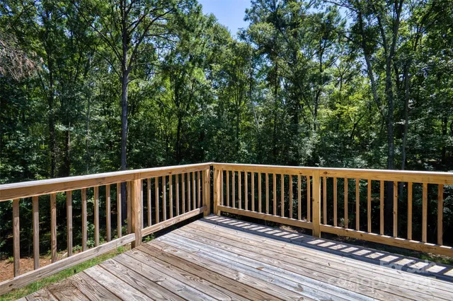 a view of wooden deck and a yard
