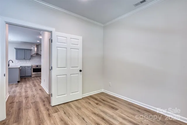 a view of a kitchen with wooden floor