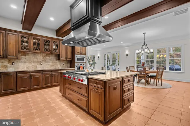 a view of a patio with table and chairs and wooden floor