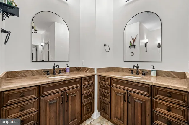 a view of a room with gym equipment and wooden floor
