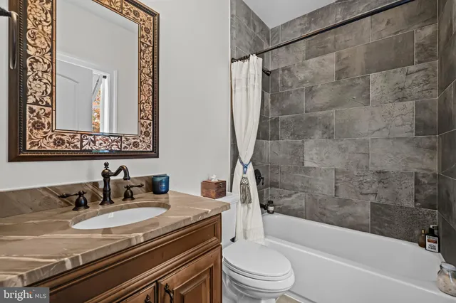 a view of a backyard with floor to ceiling windows and a lawn chair