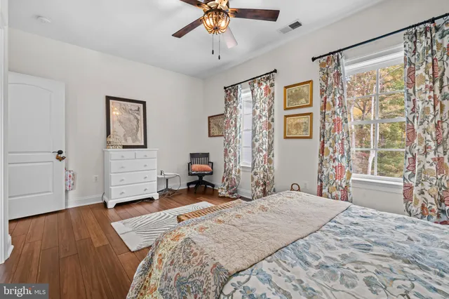 an aerial view of a house with a yard and trees
