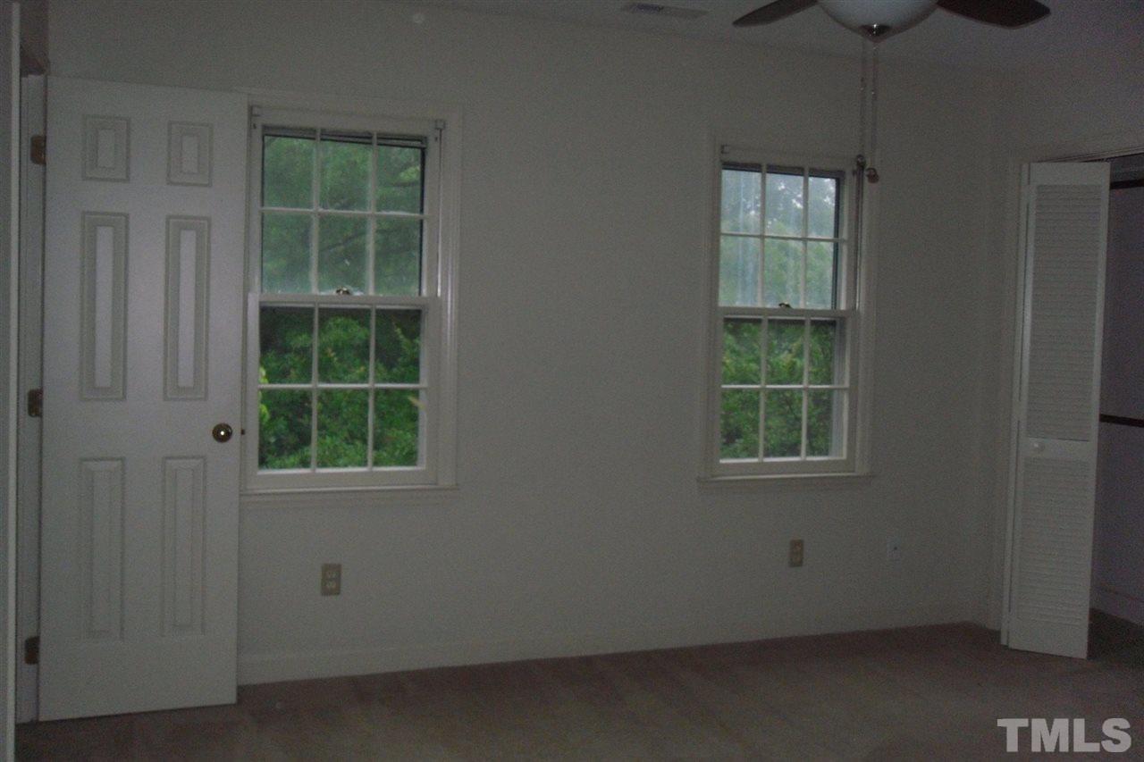 1316 Dylan Heath Court Raleigh, NC 27608 - Photo 13 of 17 an empty room with a window