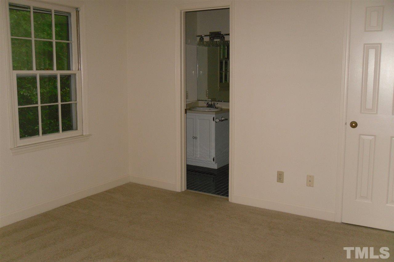 1316 Dylan Heath Court Raleigh, NC 27608 - Photo 15 of 17 a view of an empty room with a window