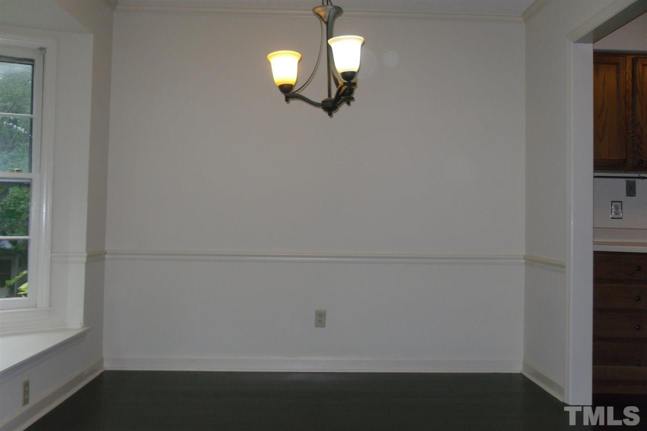 1316 Dylan Heath Court Raleigh, NC 27608 - Photo 6 of 17 a view of a chandelier fan and window in a room