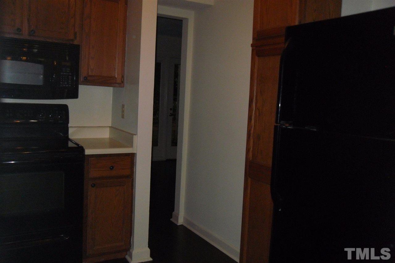 1316 Dylan Heath Court Raleigh, NC 27608 - Photo 7 of 17 a close view of hallway with a kitchen