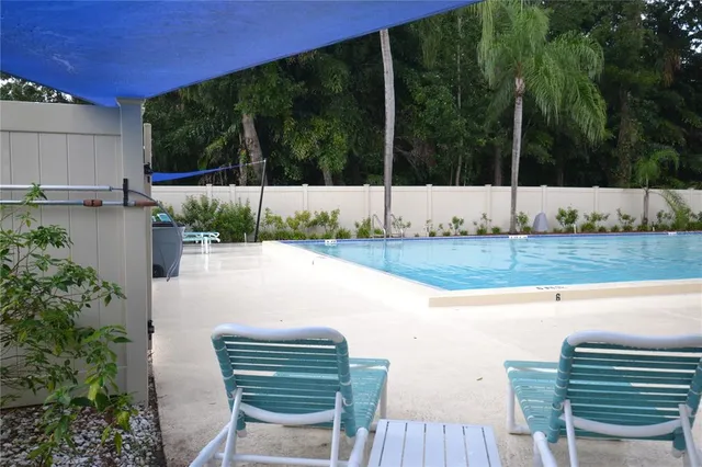 a view of a chairs and table in patio