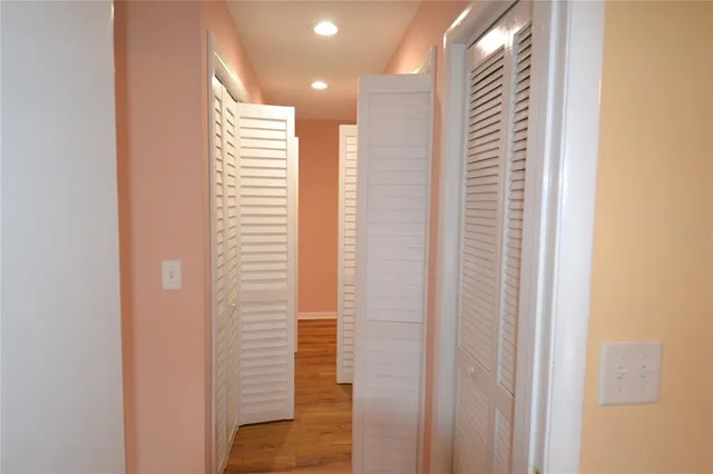 a view of a hallway with stairs