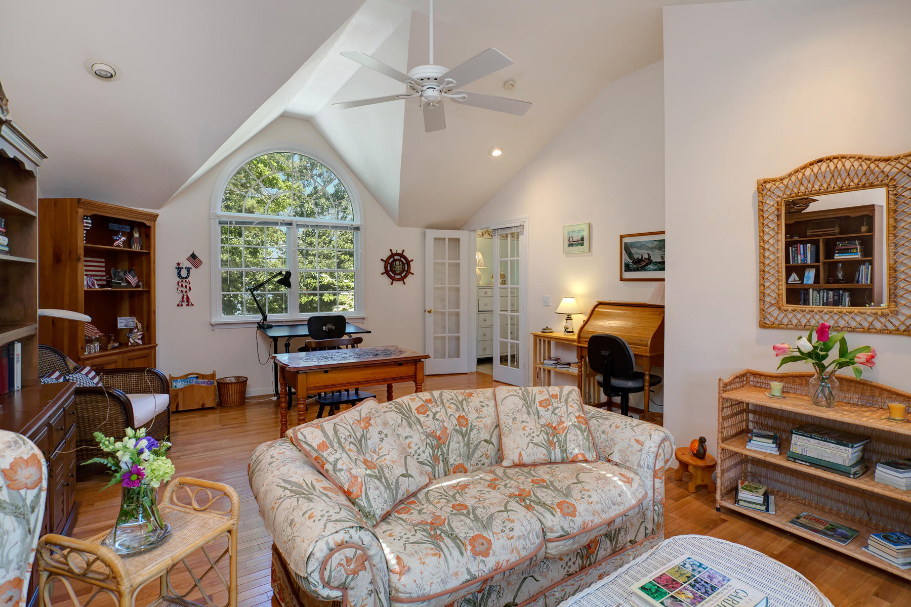 256 Monomoscoy Road Mashpee, MA 02649 - Photo 15 of 28 a living room with furniture fireplace and a large window
